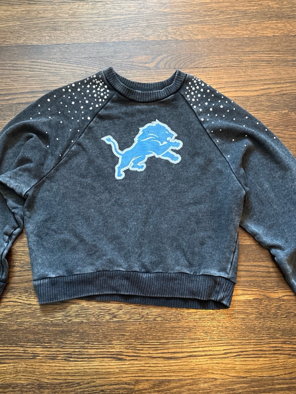 Detroit Lions Women's Black Crewneck Sweatshirt with Blue Logo and Stud Accents